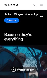 a waymo app with an image of a man driving a car
